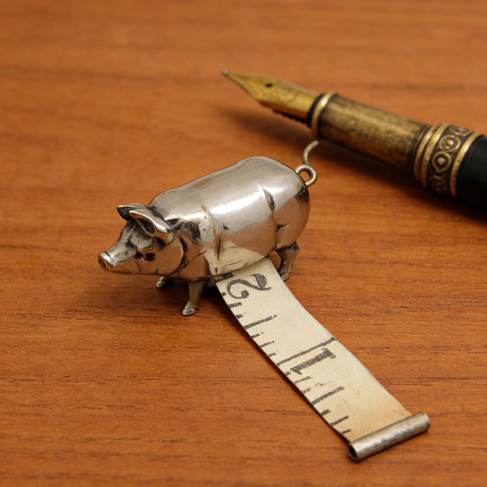 Retro-style metal pig measuring