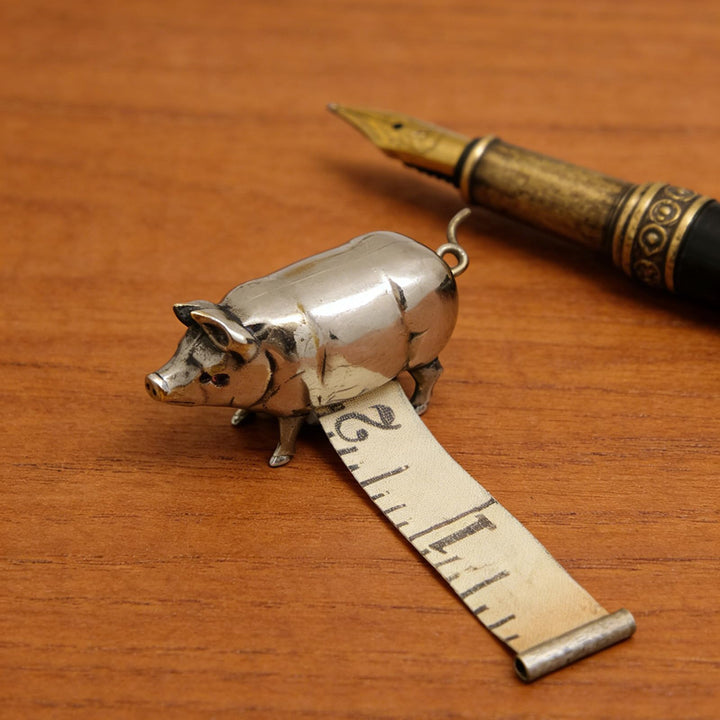 Retro-style metal pig measuring
