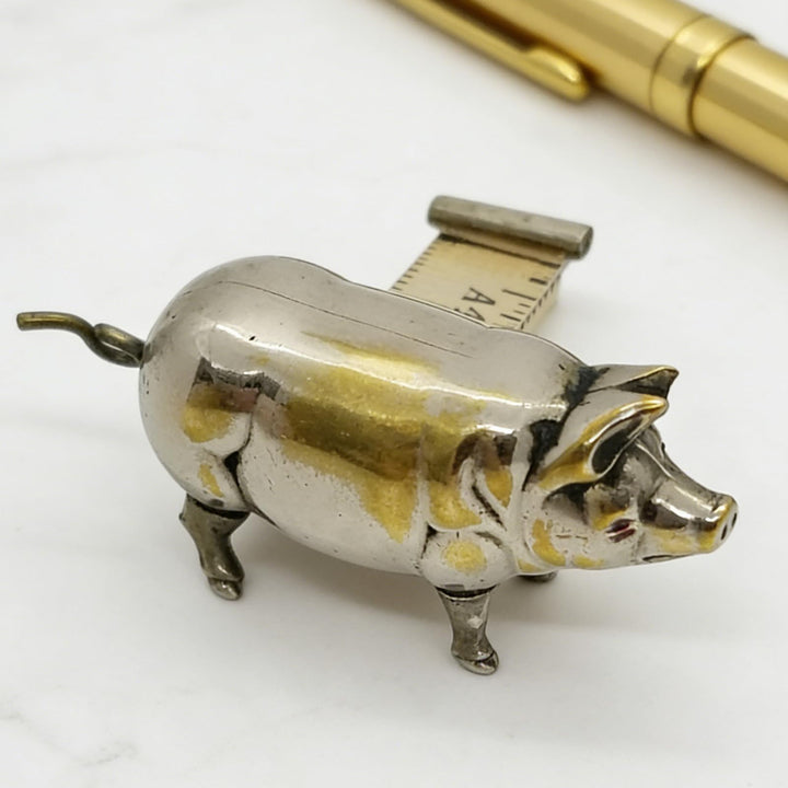 Retro-style metal pig measuring