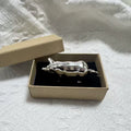 Retro-style metal pig measuring