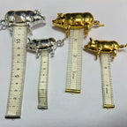 Retro-style metal pig measuring